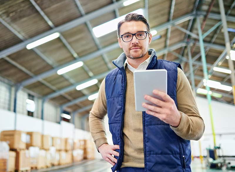 tracking-tracing-your-order-portrait-man-with-digital-tablet-working-distribution-wa1
